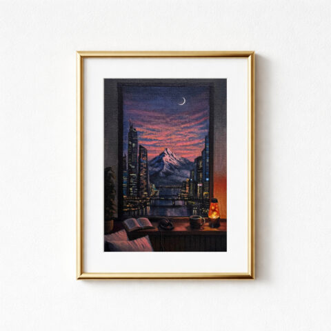 A framed art print showing a sunset cityscape through a window. The scene features illuminated skyscrapers, an alpenglow mountain and a crescent moon above the pink and orange clouds. A windowsill in the foreground holds a book, headphones, a cup of coffee, a lava lamp and a plant. A couple of pillows rest on the window seat beneath.
